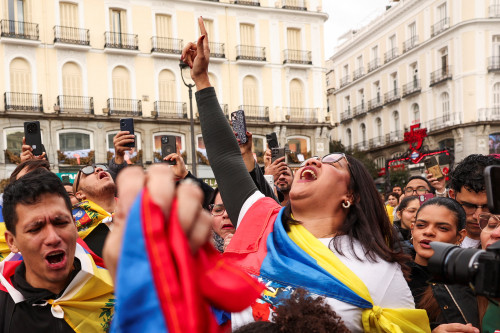 Venezuelan opposition activists in Madrid warily cheer Maduro capture