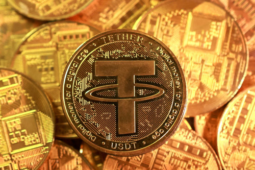 Tether cuts two gold traders hired three months ago, source says